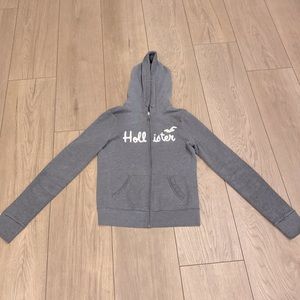 Woman’s grey zip up jacket